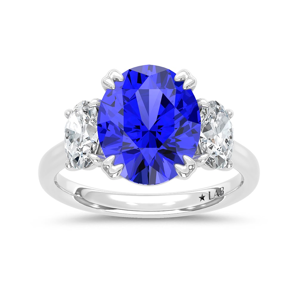 14K White Gold Lab Grown Diamond 6 Ct.Tw. Oval Shape Recrystalized Blue Sapphire Engagement Ring: 14K White Gold Lab Grown Diamond 6 Ct.Tw. Oval Shape Recrystalized Blue Sapphire Engagement Ring (Center 5 ct) Make a statement of refined elegance with this 14K white gold engagement ring. Its center