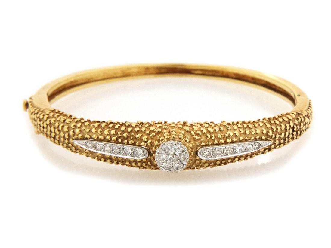 Vintage La Triomphe 18k Gold Diamond Bangle Bracelet France: Vintage La Triomphe 18k Gold Diamond Bangle Bracelet France Introducing the exquisite La Triomphe Bracelet, a vintage bangle crafted in 18k yellow and white gold. This stunning piece features a high d