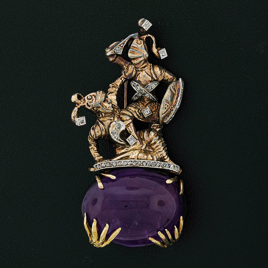 Antique 14k Gold Platinum Diamond Knights Amethyst Brooch 0.50ctw: Antique 14k Gold Platinum Diamond Knights Amethyst Brooch 0.50ctw This exquisite antique brooch showcases two intricately detailed knights fighting atop a stunning oval cabochon cut natural amethyst. 