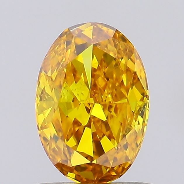 Loose Diamond - OVAL 0.73ct Fancy Vivid Orangey Yellow SI1: Loose Diamond - OVAL 0.73ct Fancy Vivid Orangey Yellow SI1 Source: This is a real non-mined Diamond that has been grown in a lab Shape: OVAL Carats: 0.73 Color: Fancy Vivid Orangey Yellow Certificatio