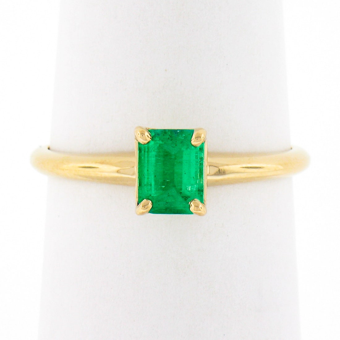 Classic 14k Yellow Gold 0.51ctw Emerald Cut Emerald Solitaire Ring: Classic 14k Yellow Gold 0.51ctw Emerald Cut Emerald Solitaire Ring This exquisite solitaire ring features a stunning emerald cut natural emerald, weighing 0.51 carats, elegantly prong set in solid 14k