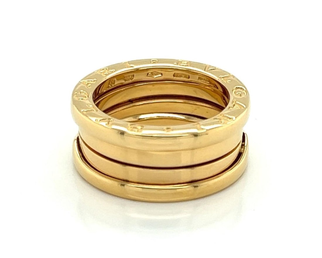 Bvlgari B.zero1 18k Yellow Gold Triple Band Ring US 4.5 EU 49: Bvlgari B.zero1 18k Yellow Gold Triple Band Ring US 4.5 EU 49 Authentic Bvlgari B.zero1 Three-Band ring crafted in 18k yellow gold. This signed fine jewelry piece features the collection's iconic trip