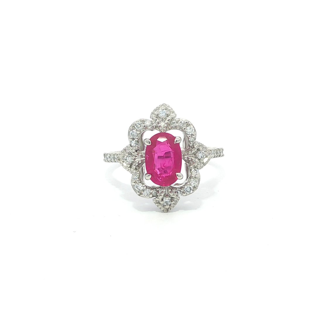 Modern Platinum Ring With GIA Burma No Heat Ruby and Diamond Accent: Modern Platinum Ring With GIA Burma No Heat Ruby and Diamond Accent This modern design cocktail ring features a natural, untreated Burma ruby with a GIA certification. The ruby, cut in an elongated ov