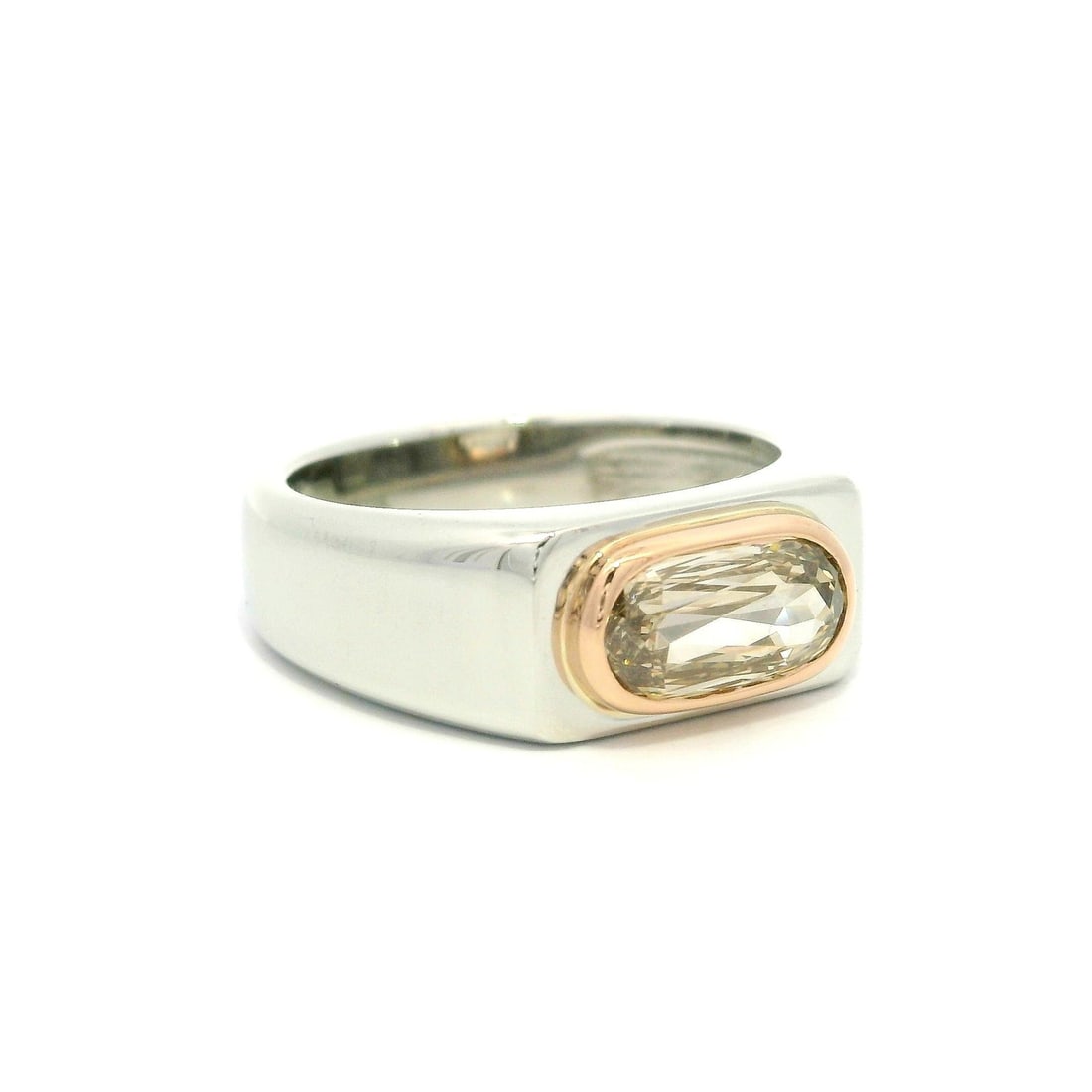 Unique Platinum and 14k Rose Gold GIA 1.18ct Fancy Diamond Band Ring: Unique Platinum and 14k Rose Gold GIA 1.18ct Fancy Diamond Band Ring This stunning unisex band ring features a unique design crafted from solid .950 platinum with a 14k rose gold bezel, showcasing an 