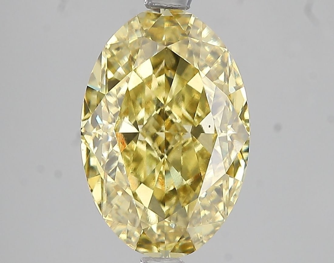 Loose Diamond - OVAL 5.05ct Fancy Vivid Yellow VS1: Loose Diamond - OVAL 5.05ct Fancy Vivid Yellow VS1 Source: This is a real non-mined Diamond that has been grown in a lab Shape: OVAL Carats: 5.05 Color: Fancy Vivid Yellow Certification: IGI Video: