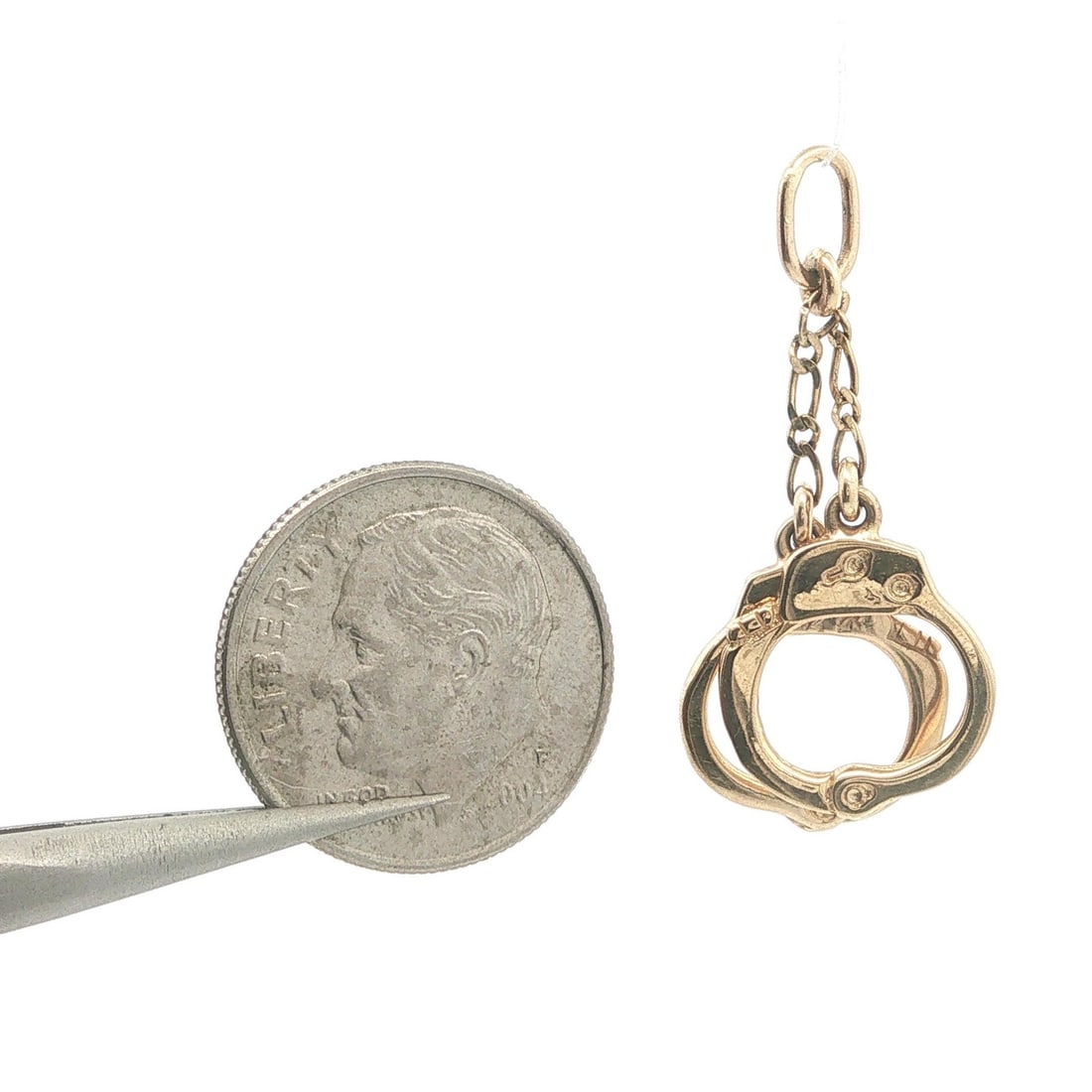Unbranded Vintage 14k Yellow Gold Handcuff Charm Pendant: Unbranded Vintage 14k Yellow Gold Handcuff Charm Pendant Vintage collectible hand cuffs dangle charm pendant crafted in solid 14k yellow gold. This pre-owned piece has no stone and retains its origina