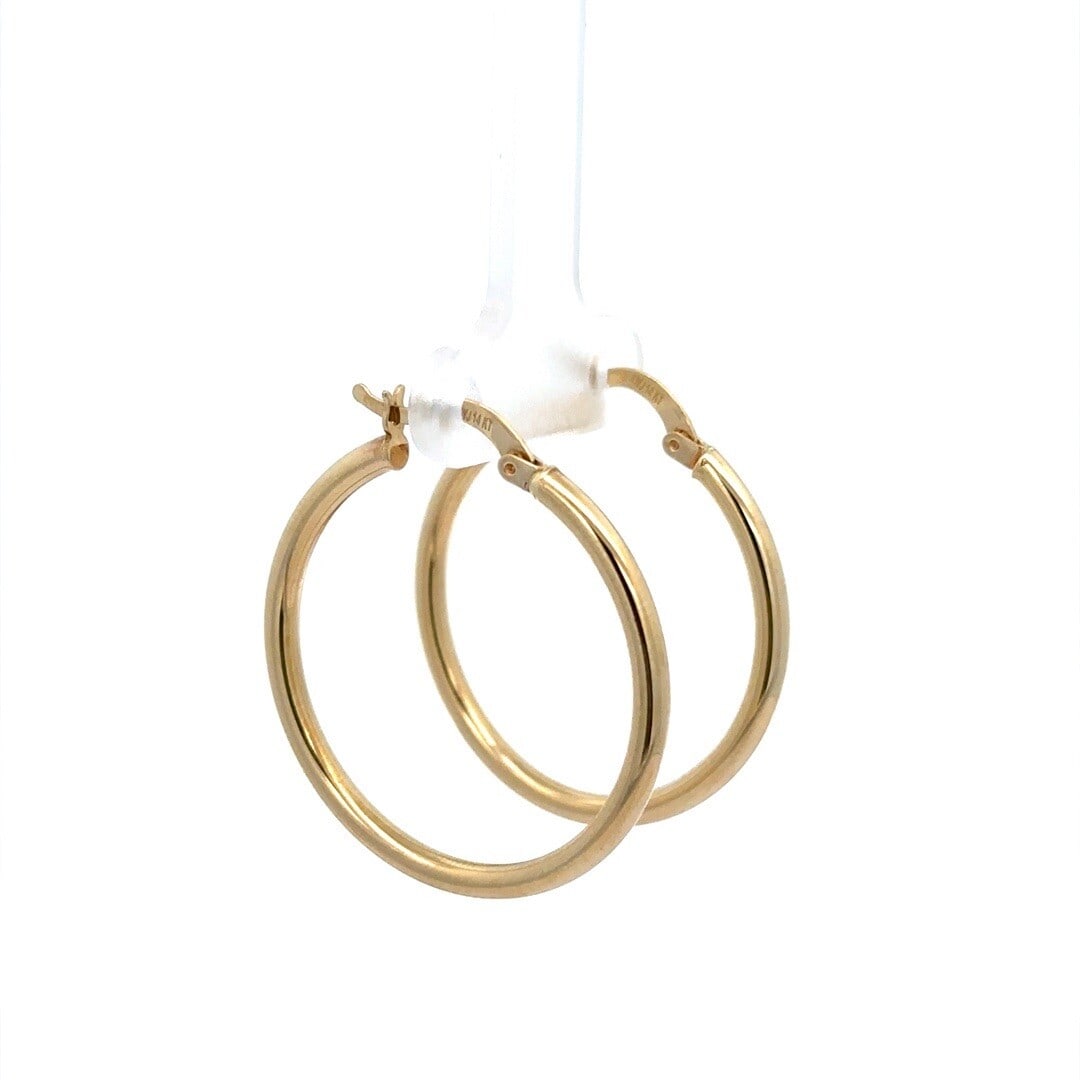 Estate Classic 14K Yellow Gold 32mm Hoop Earrings: Estate Classic 14K Yellow Gold 32mm Hoop Earrings These Estate Classic 14K Yellow Gold Large Hoop Earrings feature a stylish round tube design, ideal for enhancing any outfit. Crafted from solid 14K y