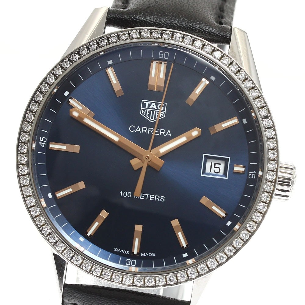 TAG Heuer Carrera WAR1114 mens quartz watch with diamond bezel date: TAG Heuer Carrera WAR1114 mens quartz watch with diamond bezel date Pre-owned TAG Heuer Carrera Date men's wristwatch with a quartz movement and navy dial. This stainless steel watch features a diamon