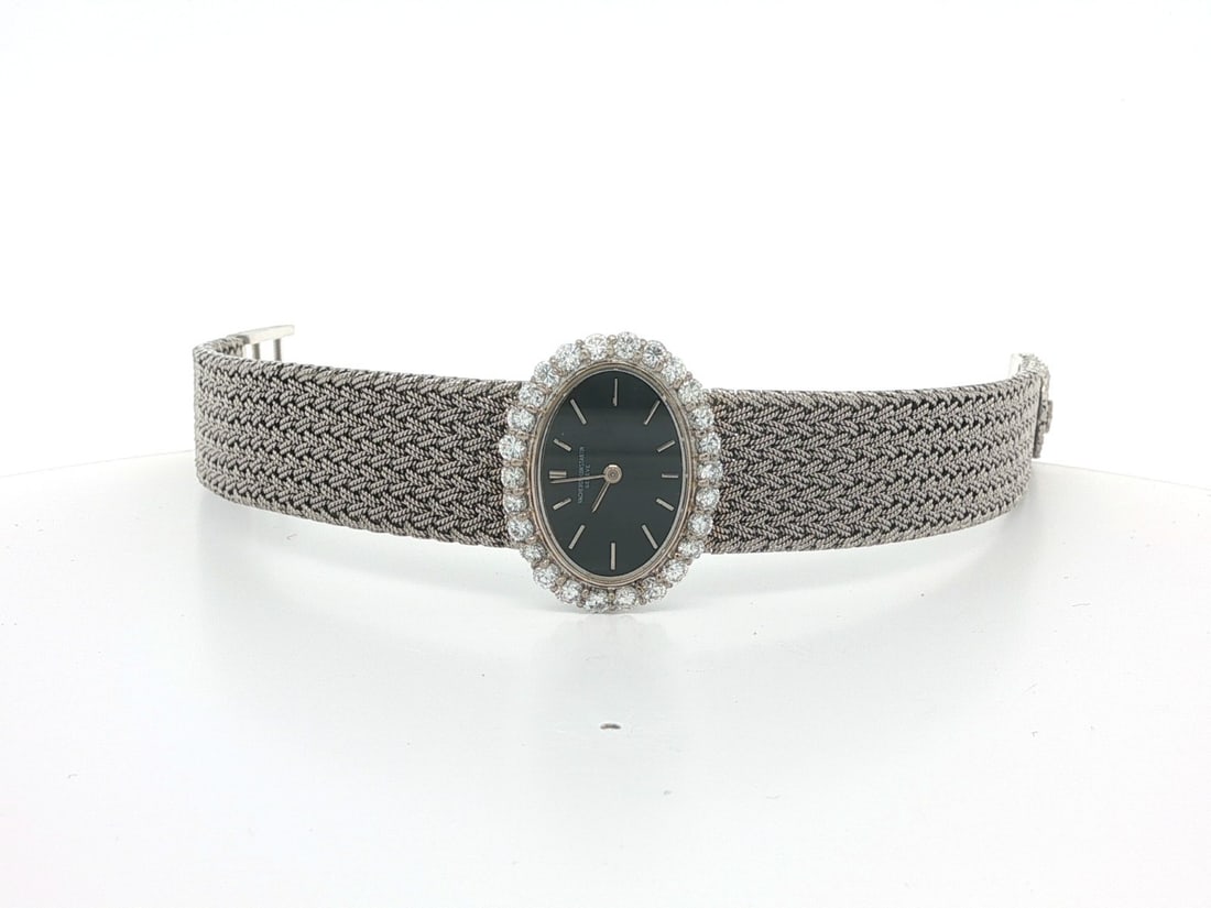Women's 18k White Gold Vacheron Constantin Diamond Bracelet Analog Wristwatch: Women's 18k White Gold Vacheron Constantin Diamond Bracelet Analog Wristwatch This vintage Vacheron Constantin wristwatch features a solid 18k white gold oval case and braided mesh bracelet. The watch