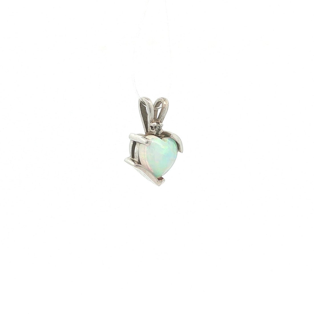 Petite Heart Pendant Charm 10k White Gold Opal Diamond: Petite Heart Pendant Charm 10k White Gold Opal Diamond Petite heart pendant charm crafted in solid 10k white gold, featuring a natural heart cabochon opal accented by one diamond. The opal displays fi