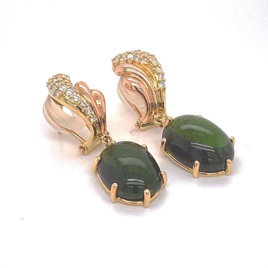 Vintage 18k Two Tone Gold Green Tourmaline Diamond Drop Earrings: Vintage 18k Two Tone Gold Green Tourmaline Diamond Drop Earrings Vintage estate dangle earrings featuring natural oval cabochon green tourmalines accented by natural diamonds. Crafted in 18k yellow an