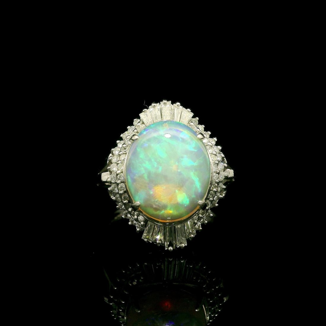 Platinum 2.83ctw Oval Cabochon Opal Diamond Halo Cocktail Ring: Platinum 2.83ctw Oval Cabochon Opal Diamond Halo Cocktail Ring This stunning cocktail ring features a 2.28ct natural genuine opal in an oval cabochon cut, beautifully prong set to showcase its white b