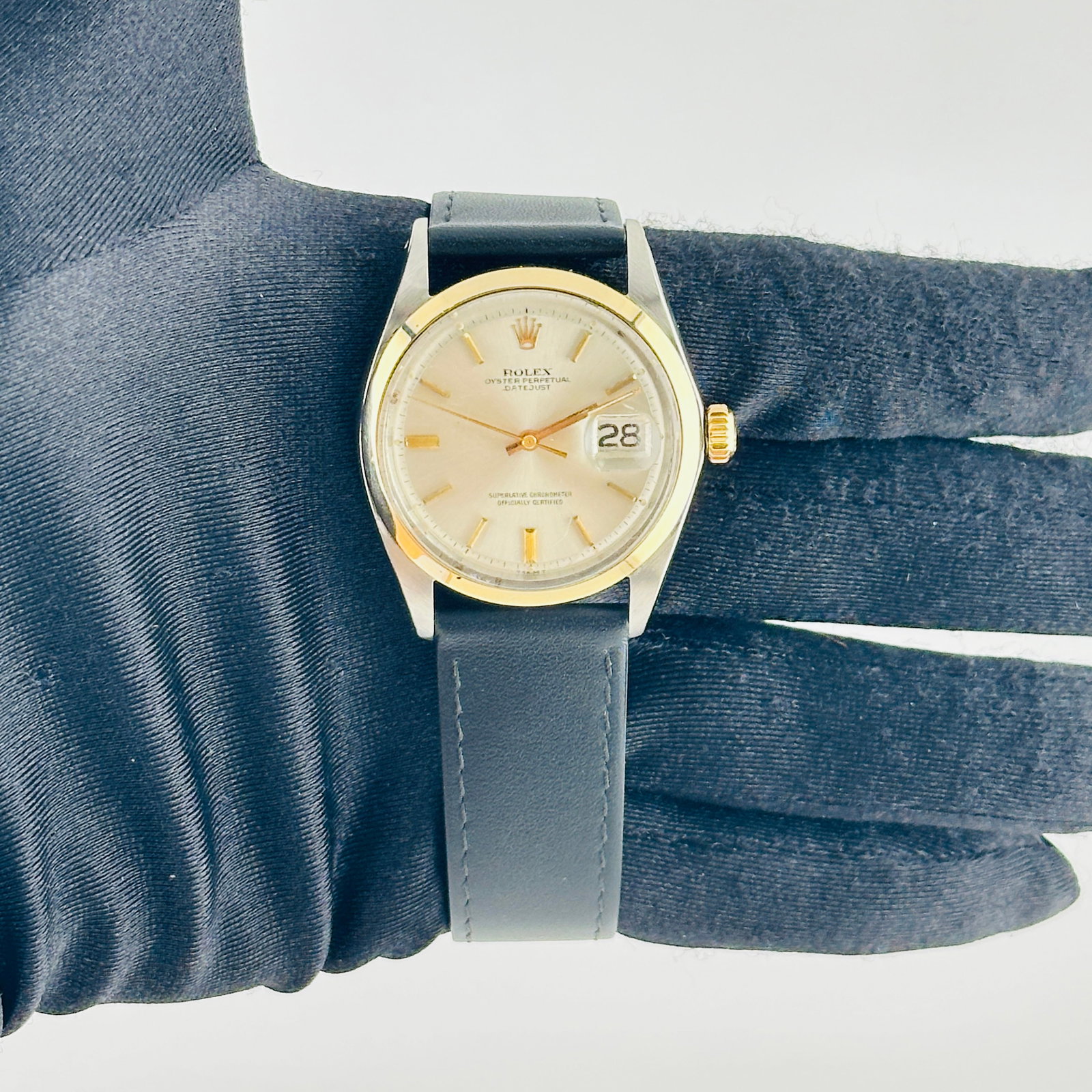 Rolex Datejust Mens 1600 3 Silver Gold Stick Dial Leather Band: Rolex Datejust Mens 1600 3 Silver Gold Stick Dial Leather Band This Rolex Datejust features a silver and gold stick dial paired with a smooth bezel and is presented on a generic leather band. The watc