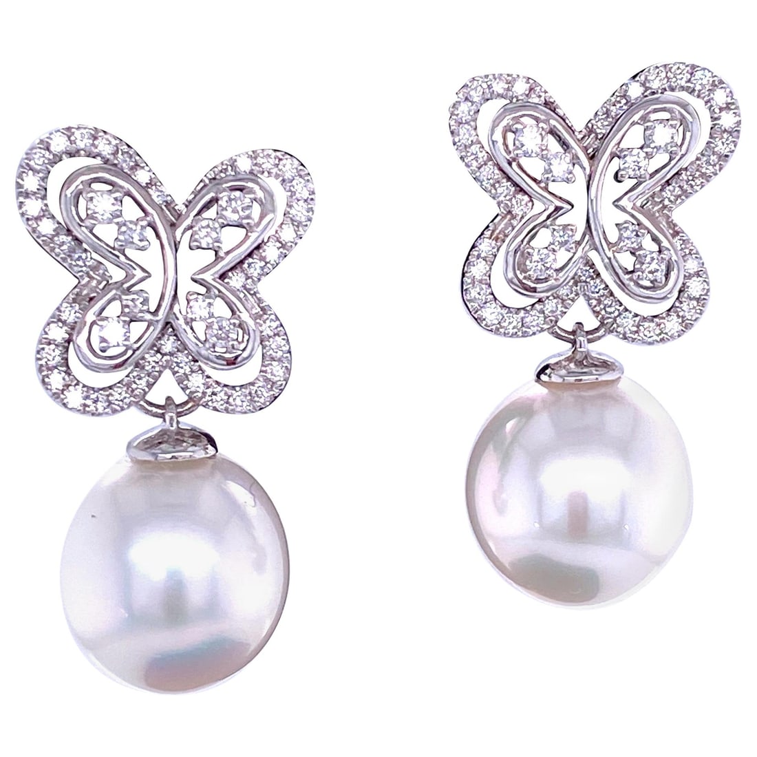 Harbor Diamonds 18K White Gold South Sea Pearl Diamond Butterfly Earrings: Harbor Diamonds 18K White Gold South Sea Pearl Diamond Butterfly Earrings Indulge in elegance with these stunning South Sea Pearl Diamond Butterfly Drop Earrings. Crafted from luxurious 18K white gold
