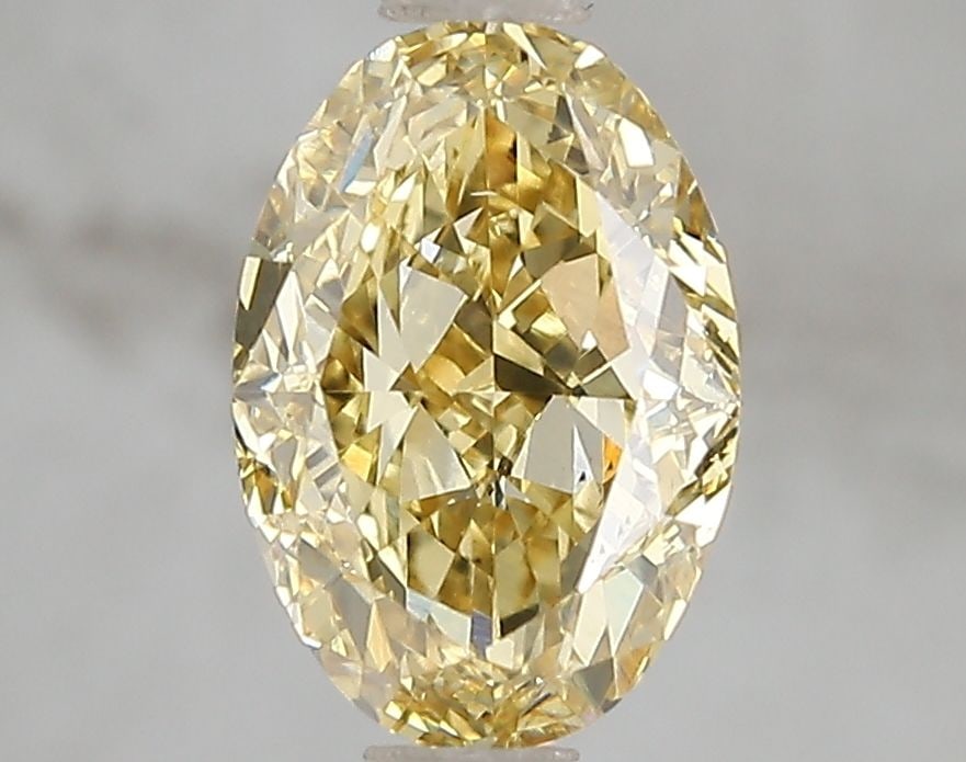 Loose Diamond - OVAL 2.03ct Fancy Vivid Yellow VS2: Loose Diamond - OVAL 2.03ct Fancy Vivid Yellow VS2 Source: This is a real non-mined Diamond that has been grown in a lab Shape: OVAL Carats: 2.03 Color: Fancy Vivid Yellow Certification: IGI Video: