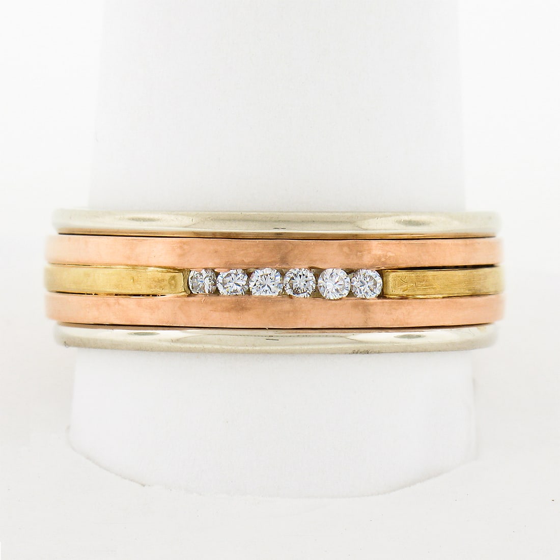 Mens Vintage 14k Multi Tone Gold Diamond Wedding Band Ring 0.10 ctw: Mens Vintage 14k Multi Tone Gold Diamond Wedding Band Ring 0.10 ctw Vintage men's band ring crafted in solid 14k multi-tone gold with a grooved design and channel-set natural diamonds. This retro-era 