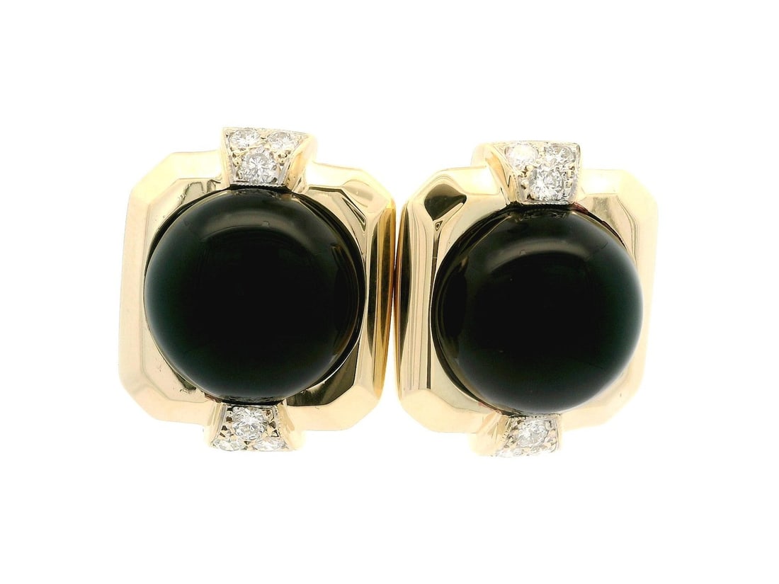 Omega 14k Yellow Gold Black Onyx Diamond Accent Button Earrings: Omega 14k Yellow Gold Black Onyx Diamond Accent Button Earrings This exquisite pair of stud earrings features a large round black onyx centerpiece, complemented by sparkling diamond accents. Crafted f