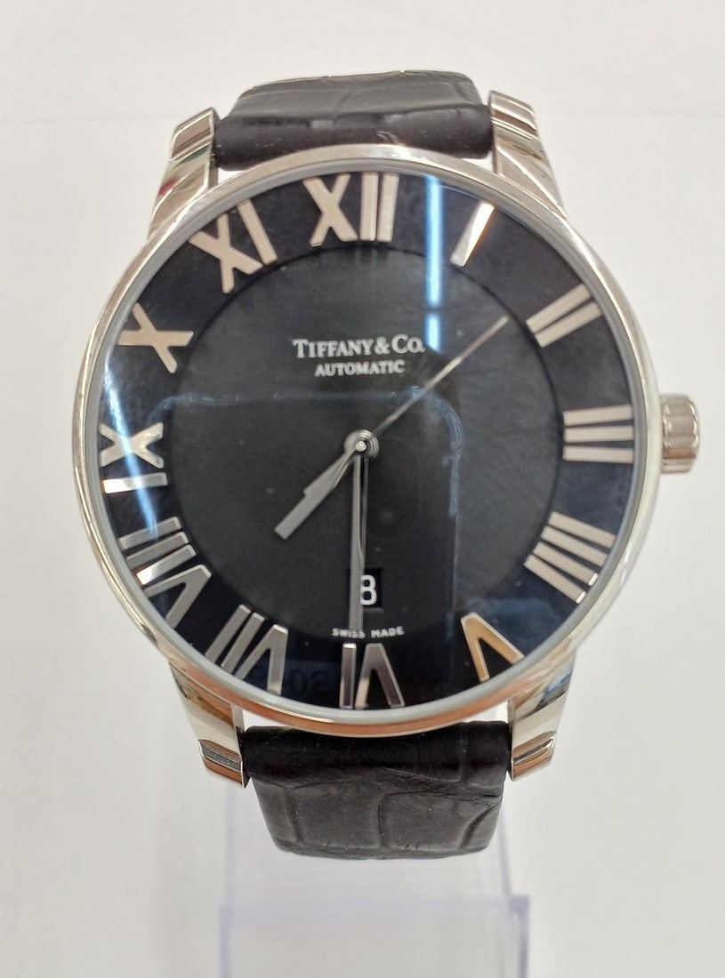 TIFFANY&Co. Atlas Dome mens wristwatch ref Z1800.68.10A10A50A: TIFFANY&Co. Atlas Dome mens wristwatch ref Z1800.68.10A10A50A Pre-owned TIFFANY&Co. Atlas Dome men's wristwatch with quartz movement and a leather/fabric strap. This Swiss-made watch features sapphire