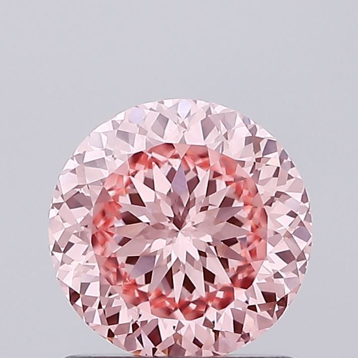 Loose Diamond - ROUND 1.1ct Fancy Vivid Pink VS1: Loose Diamond - ROUND 1.1ct Fancy Vivid Pink VS1 Source: This is a real non-mined Diamond that has been grown in a lab Shape: ROUND Carats: 1.1 Color: Fancy Vivid Pink Certification: IGI Video: