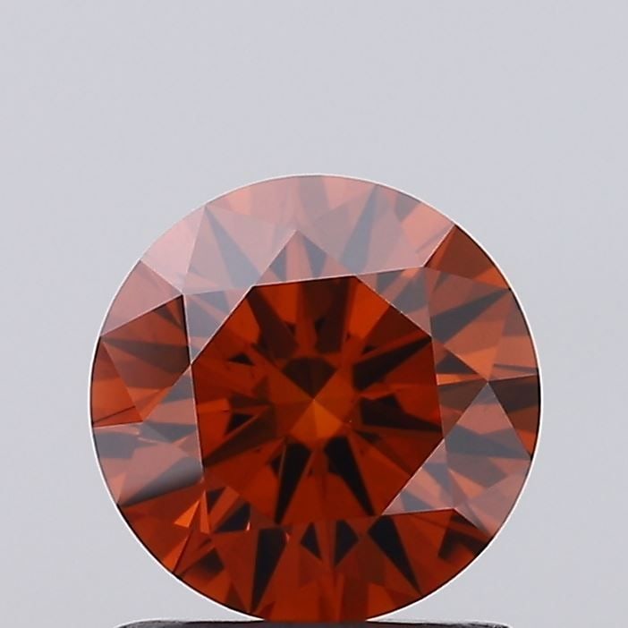 Ideal Loose Diamond - ROUND 1.07ct Fancy Vivid Orange VS2: Ideal Loose Diamond - ROUND 1.07ct Fancy Vivid Orange VS2 Source: This is a real non-mined Diamond that has been grown in a lab Shape: ROUND Carats: 1.07 Color: Fancy Vivid Orange Certification: IGI