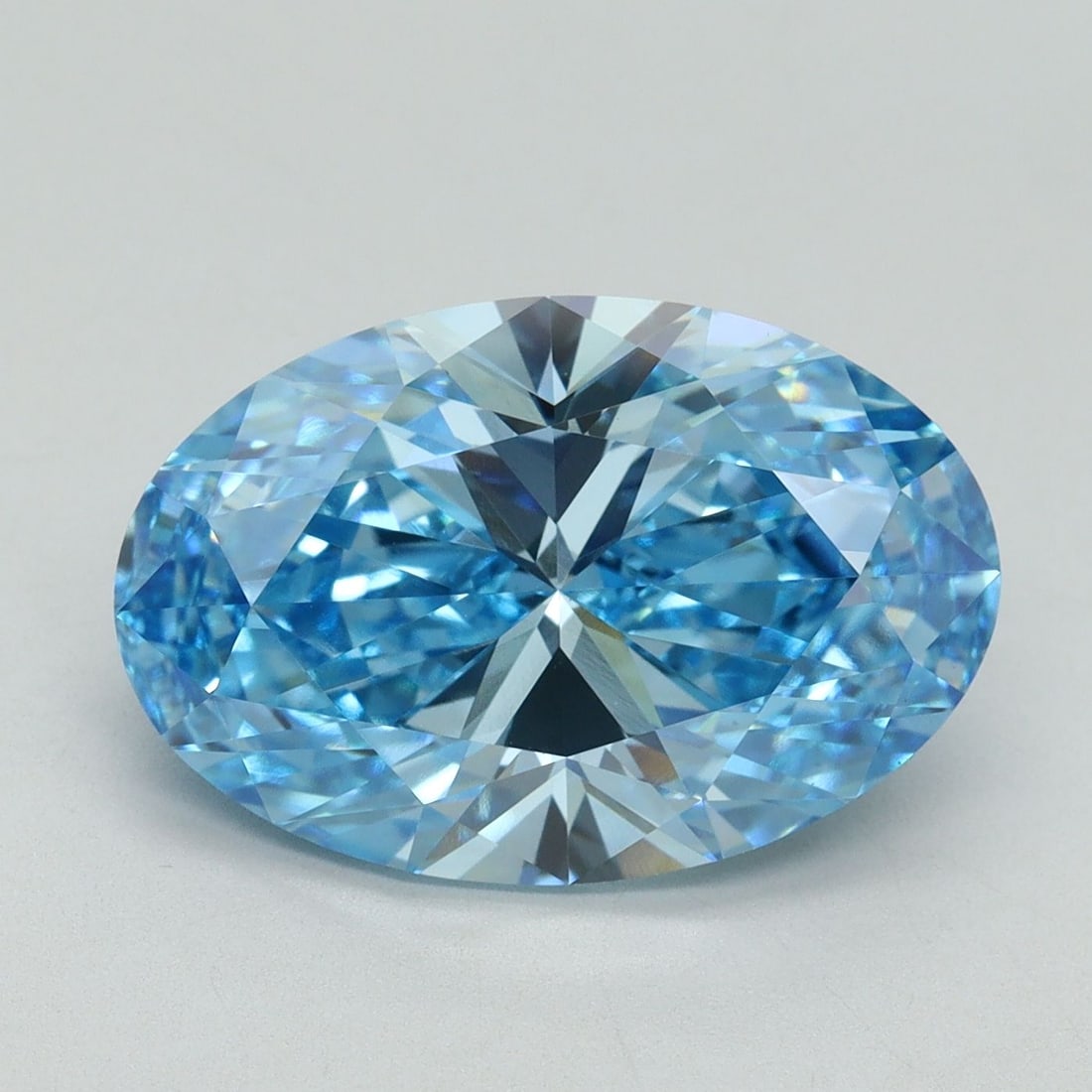 Loose Diamond - OVAL 6.01ct Fancy Vivid Blue VVS2: Loose Diamond - OVAL 6.01ct Fancy Vivid Blue VVS2 Source: This is a real non-mined Diamond that has been grown in a lab Shape: OVAL Carats: 6.01 Color: Fancy Vivid Blue Certification: IGI Video: