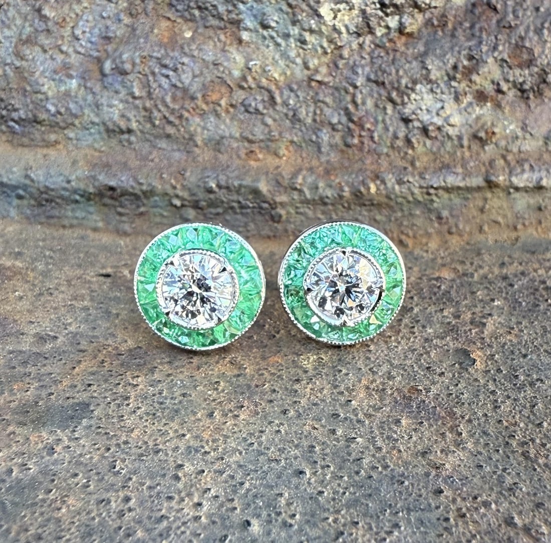 Diamond and Emerald Halo Stud Earrings in 18k White Gold with GIA Certification: Diamond and Emerald Halo Stud Earrings in 18k White Gold with GIA Certification These un-used stud earrings feature two natural round brilliant cut diamonds, each GIA-certified with D color and VS2 cl