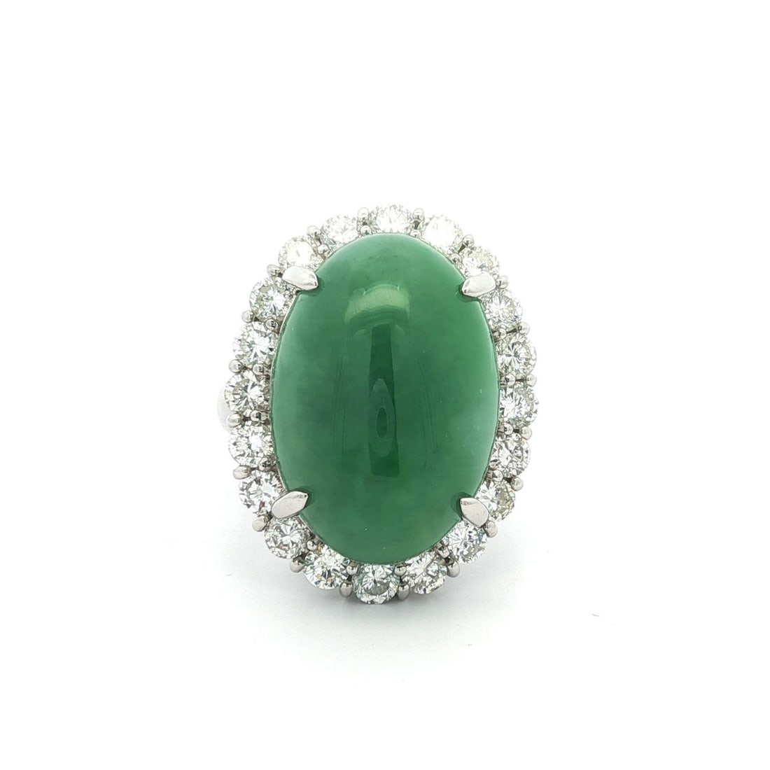 Platinum Cocktail Ring with GIA Burma A Jade and Diamond Halo 24.03ctw: Platinum Cocktail Ring with GIA Burma A Jade and Diamond Halo 24.03ctw A pre-owned women's cocktail ring featuring a natural green Burma A jade center stone framed by a diamond halo. Crafted in solid 