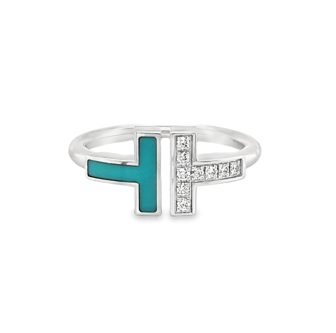 Tiffany & Co. T Wire 18k White Gold Ring with Turquoise and Diamonds Size 6: Tiffany & Co. T Wire 18k White Gold Ring with Turquoise and Diamonds Size 6 Authentic Tiffany & Co. T Wire Diamond & Turquoise ring crafted in 18k white gold. This pre-owned ring features the signatur