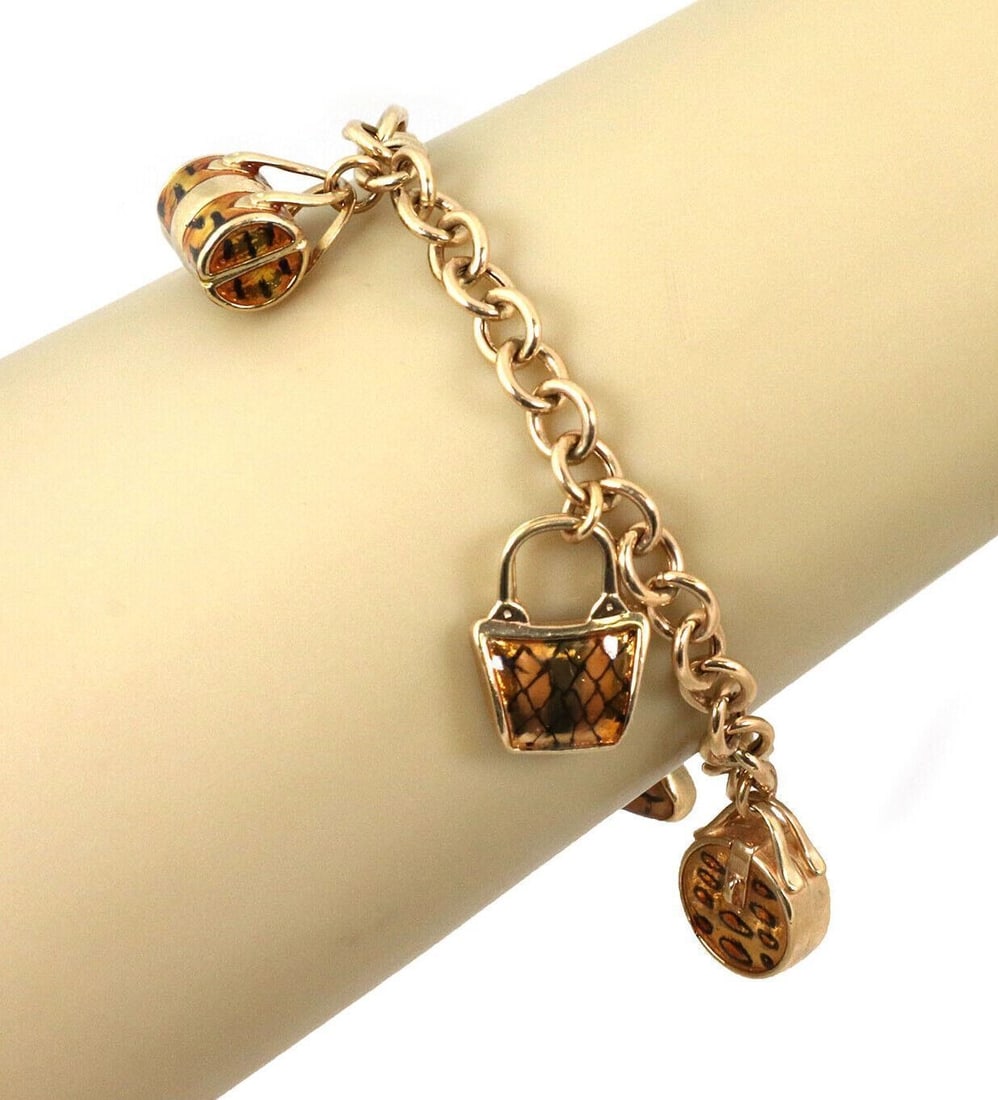 14k Yellow Gold Charm Link Bracelet with 5 Enamel Handbag Charms 7.25": 14k Yellow Gold Charm Link Bracelet with 5 Enamel Handbag Charms 7.25" Estate charm link bracelet crafted in solid 14k yellow gold, featuring five handbag-shaped charms with yellow and black enamel ac