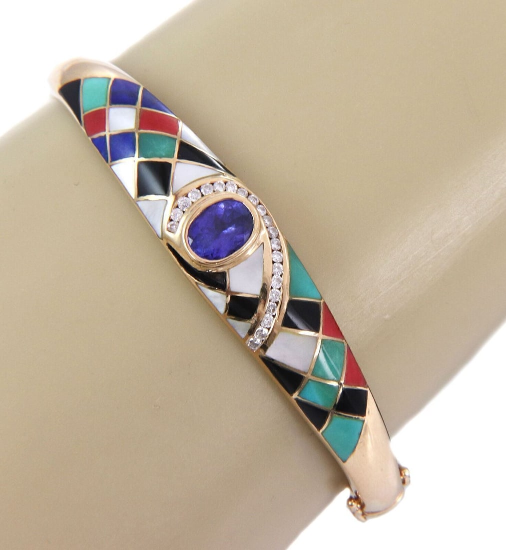 14k Yellow Gold Bangle Bracelet with Tanzanite Diamond Gem Inlay: 14k Yellow Gold Bangle Bracelet with Tanzanite Diamond Gem Inlay Vintage estate bangle bracelet crafted in 14k yellow gold with a multicolor gemstone inlay design, accented by natural tanzanite and na