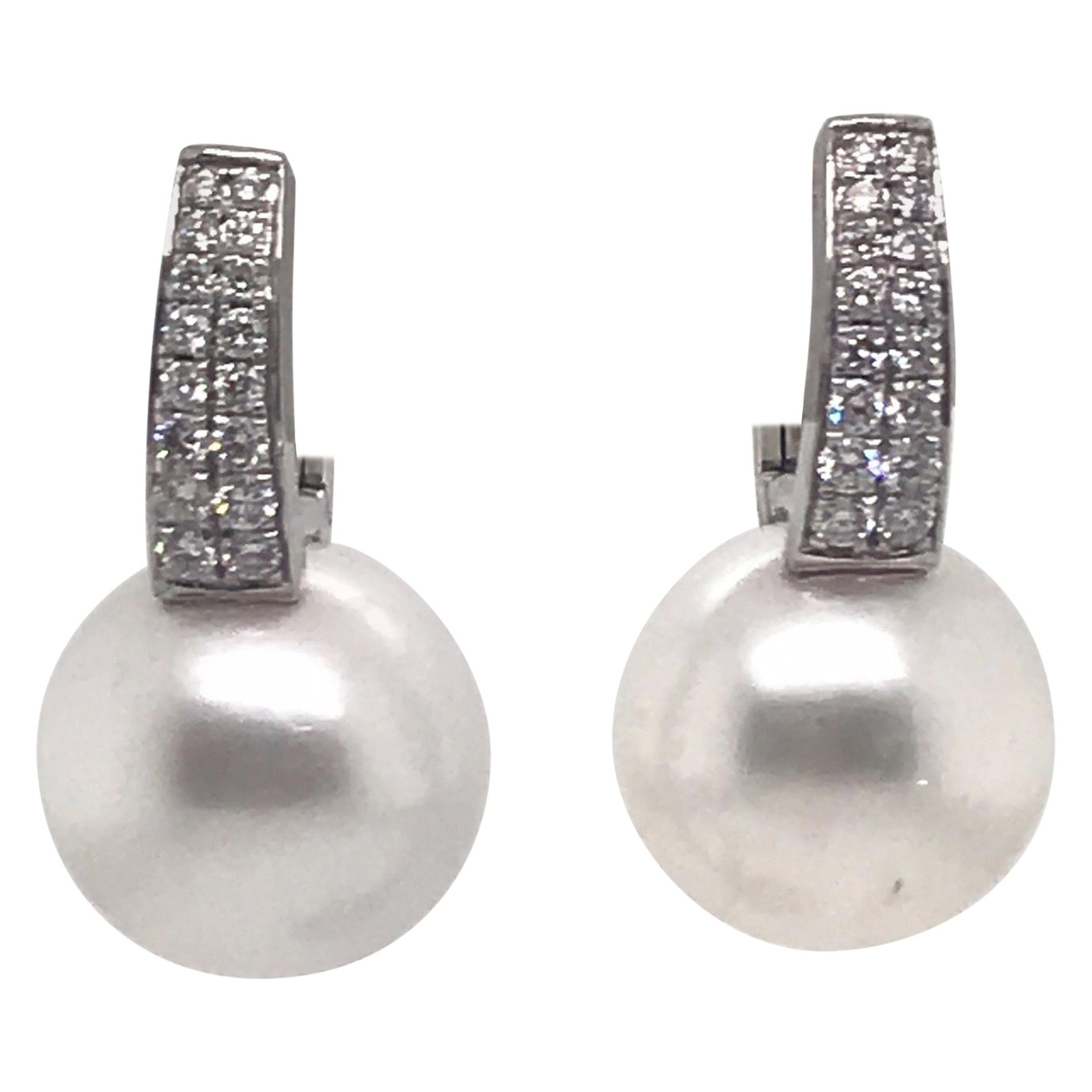 Harbor Diamonds 18K White Gold South Sea Pearl Diamond Drop Earrings: Harbor Diamonds 18K White Gold South Sea Pearl Diamond Drop Earrings Elevate your elegance with these stunning drop earrings crafted in 18K white gold. Featuring two exquisite South Sea pearls, each m
