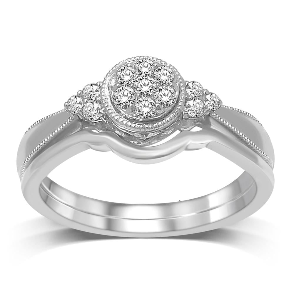 10K White Gold 1/5 Ct.tw Diamond Bridal Ring: 10K White Gold 1/5 Ct.tw Diamond Bridal Ring This eye-catching Bridal Ring is available in 10K White Gold. There is 1 round diamond with a total carat weight of 1/5 Ct.Tw. set in a shared prong settin