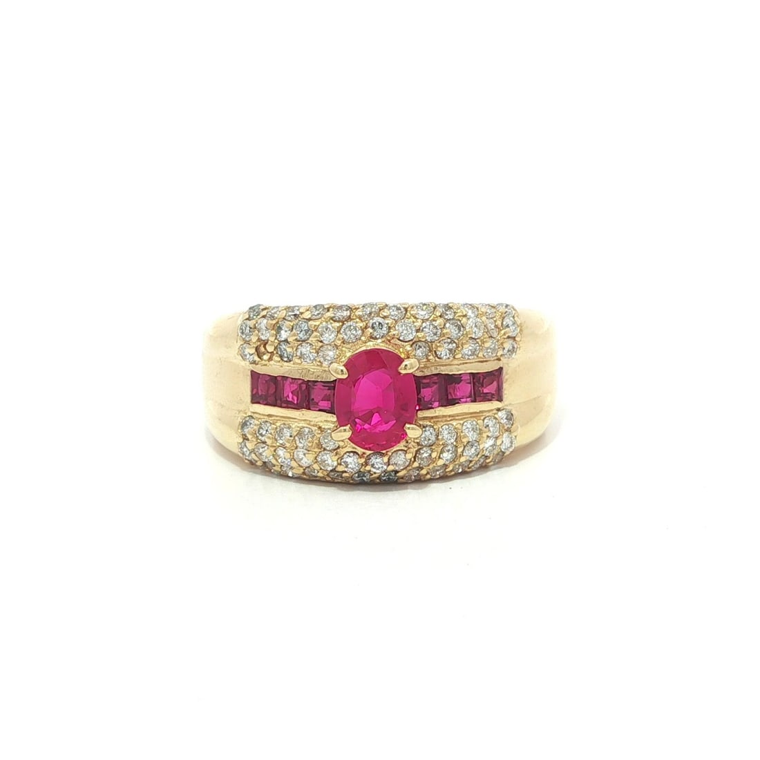 Wide 18k Gold Band Ring with Natural Oval and Square Rubies and Diamonds: Wide 18k Gold Band Ring with Natural Oval and Square Rubies and Diamonds This wide band ring features a striking arrangement of natural rubies and diamonds set in 18k yellow gold. The centerpiece incl