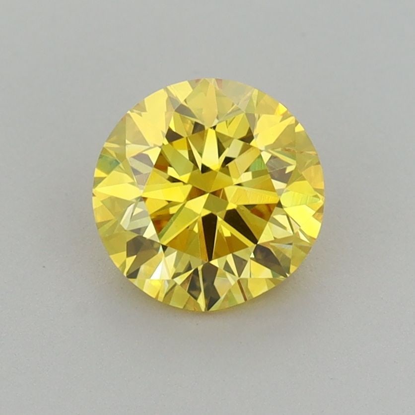 Loose Diamond - ROUND 1.01ct Fancy Vivid Yellow VVS2: Loose Diamond - ROUND 1.01ct Fancy Vivid Yellow VVS2 Source: This is a real non-mined Diamond that has been grown in a lab Shape: ROUND Carats: 1.01 Color: Fancy Vivid Yellow Certification: IGI Video: