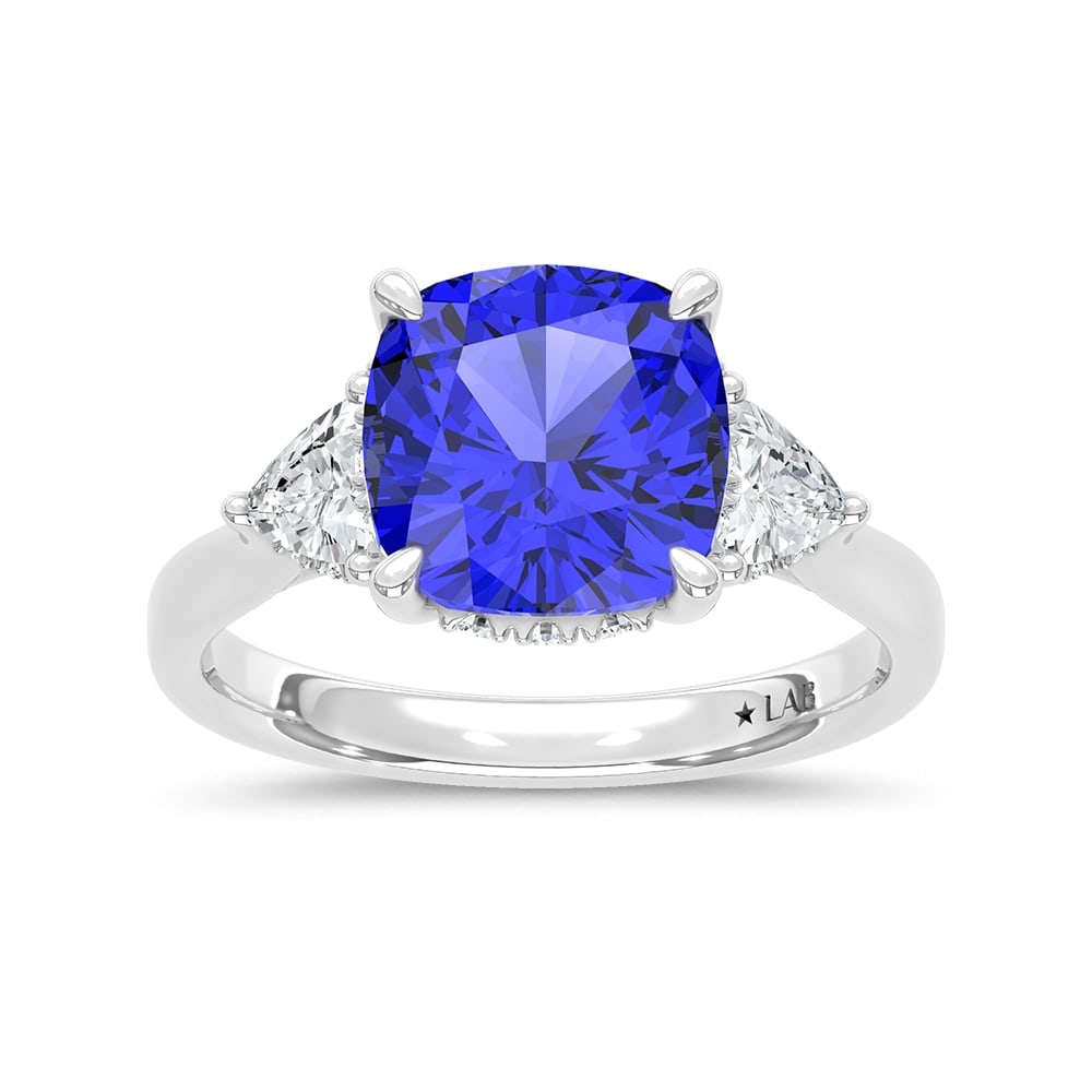 14K White Gold Lab Grown Diamond 5 1/5 Ct.Tw. Cushion Shape Recrystalized Blue Sapphire Engagement: 14K White Gold Lab Grown Diamond 5 1/5 Ct.Tw. Cushion Shape Recrystalized Blue Sapphire Engagement Ring (Center 4 1/2 ct) Exude timeless elegance with this 14K white gold engagement ring, featuring a 