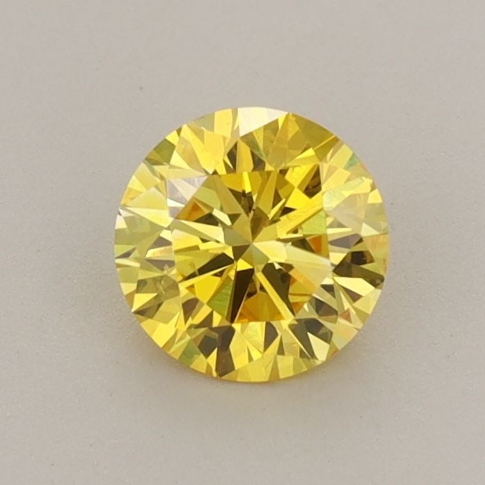Loose Diamond - ROUND 0.7ct Fancy Vivid Yellow VS2: Loose Diamond - ROUND 0.7ct Fancy Vivid Yellow VS2 Source: This is a real non-mined Diamond that has been grown in a lab Shape: ROUND Carats: 0.7 Color: Fancy Vivid Yellow Certification: IGI Video: