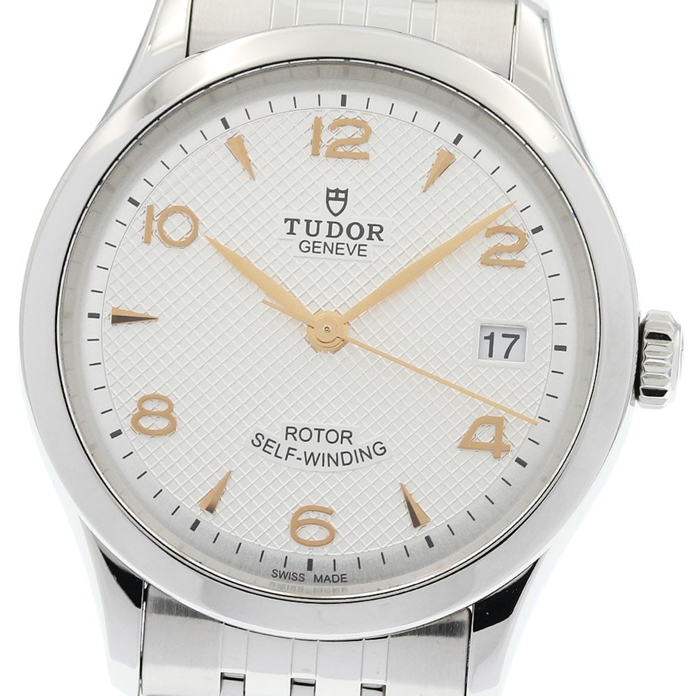 TUDOR 1926 Ref 91450 mens automatic date wristwatch: TUDOR 1926 Ref 91450 mens automatic date wristwatch TUDOR 1926 Date automatic men's wristwatch, reference 91450, with a silver dial and stainless steel case and bracelet. This pre-owned Swiss-made wat