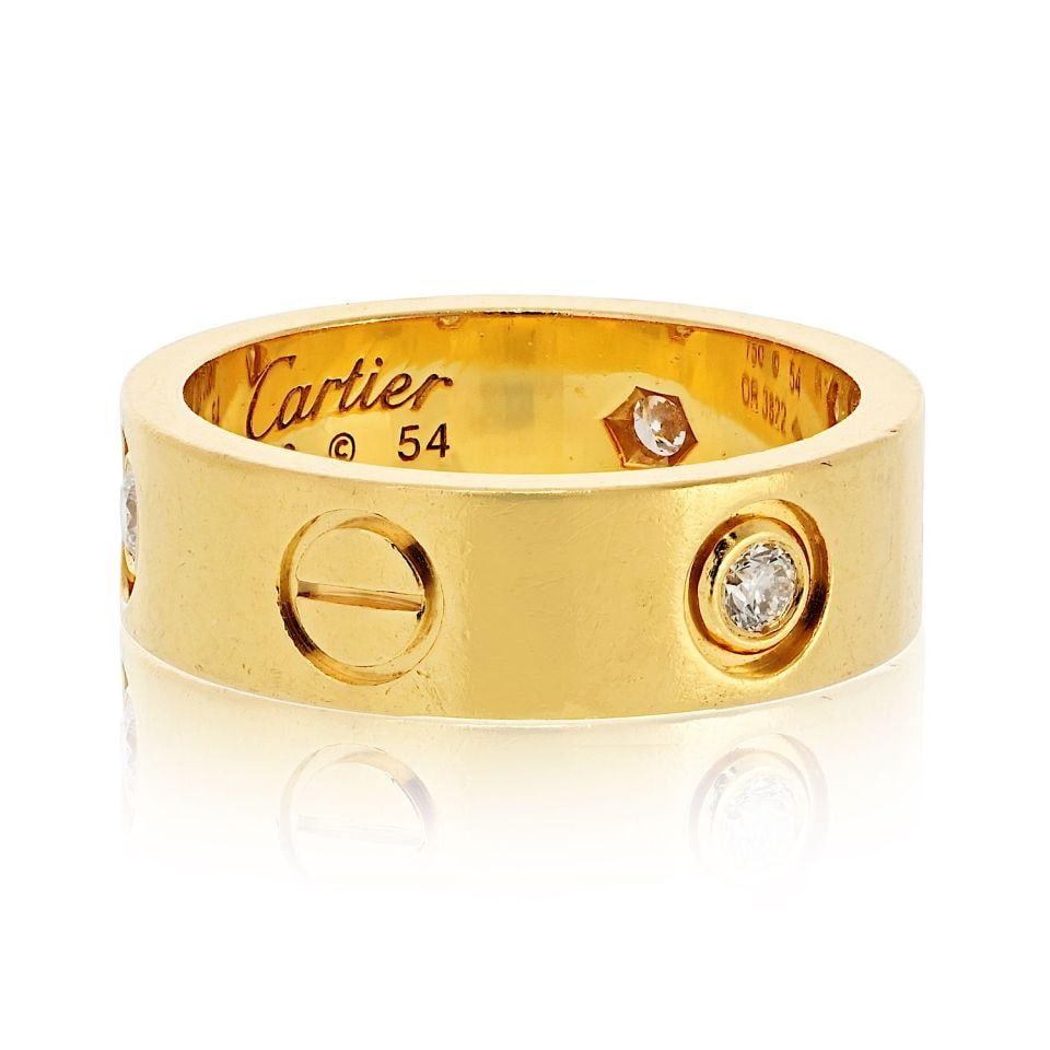 Cartier Love 18K Yellow Gold Ring with 3 Diamonds Size 54: Cartier Love 18K Yellow Gold Ring with 3 Diamonds Size 54 This Cartier Love ring is crafted from luxurious 18K yellow gold and features three brilliant round-cut diamonds set flush within the band, sh