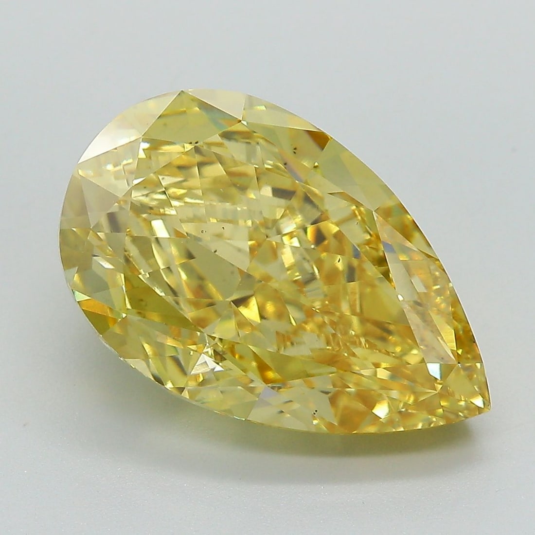 Loose Diamond - PEAR 8.68ct Fancy Vivid Yellow VS2: Loose Diamond - PEAR 8.68ct Fancy Vivid Yellow VS2 Source: This is a real non-mined Diamond that has been grown in a lab Shape: PEAR Carats: 8.68 Color: Fancy Vivid Yellow Certification: IGI Video: