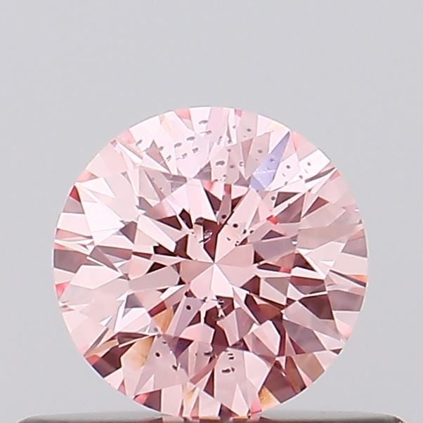 Loose Diamond - ROUND 0.39ct Fancy Vivid Pink SI1: Loose Diamond - ROUND 0.39ct Fancy Vivid Pink SI1 Source: This is a real non-mined Diamond that has been grown in a lab Shape: ROUND Carats: 0.39 Color: Fancy Vivid Pink Certification: IGI Video: