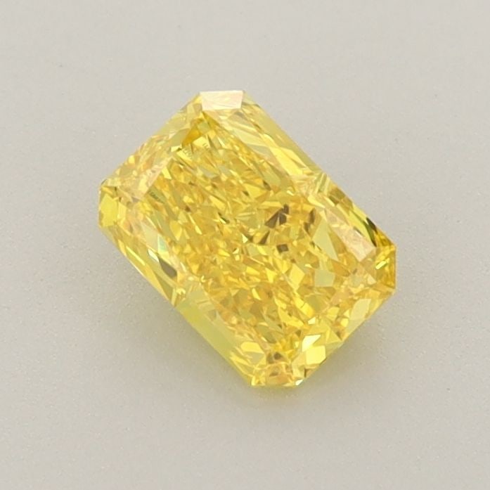 Loose Diamond - RADIANT 0.65ct Fancy Vivid Yellow VS1: Loose Diamond - RADIANT 0.65ct Fancy Vivid Yellow VS1 Source: This is a real non-mined Diamond that has been grown in a lab Shape: RADIANT Carats: 0.65 Color: Fancy Vivid Yellow Certification: IGI Vid