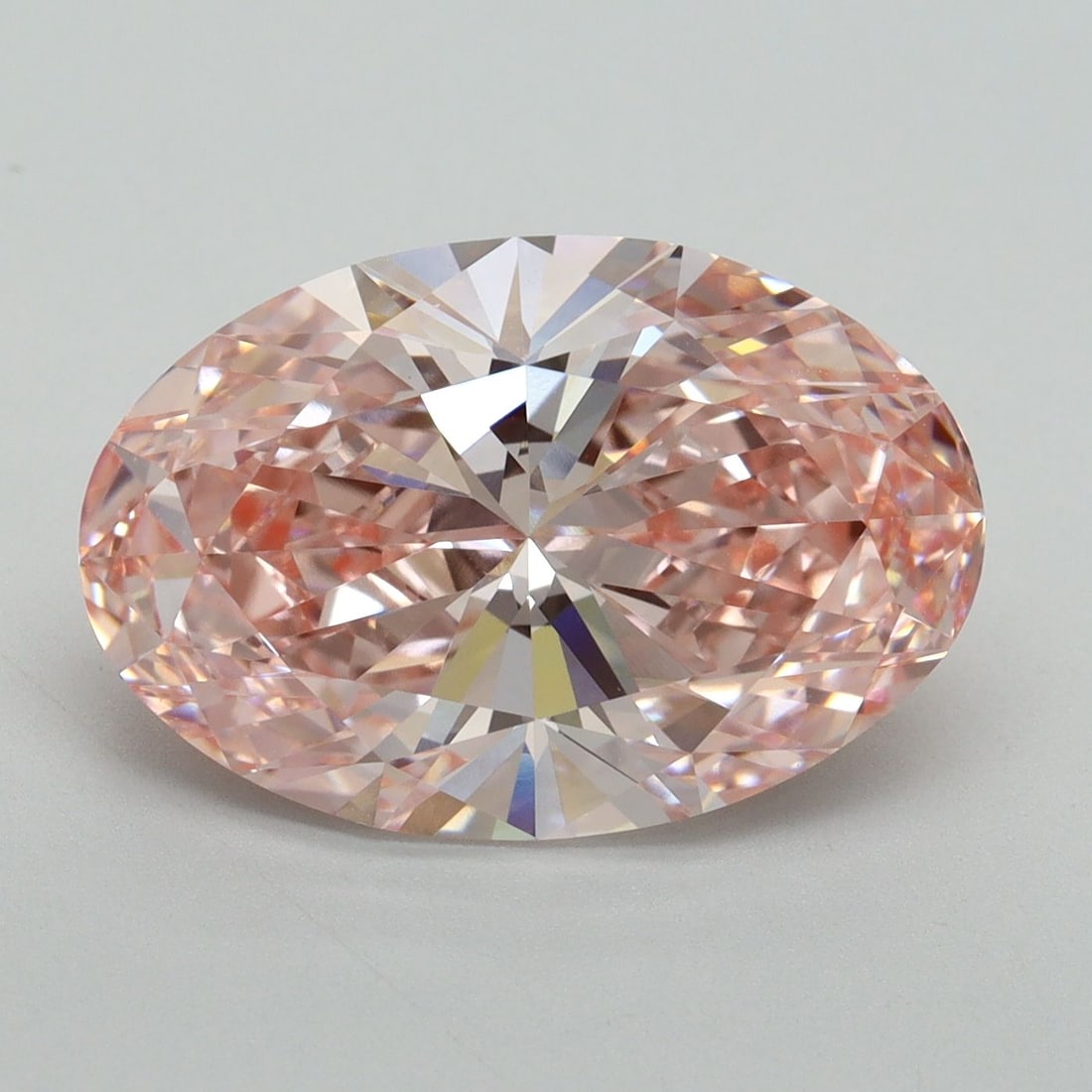 Loose Diamond - OVAL 6.14ct Fancy Vivid Pink VVS2: Loose Diamond - OVAL 6.14ct Fancy Vivid Pink VVS2 Source: This is a real non-mined Diamond that has been grown in a lab Shape: OVAL Carats: 6.14 Color: Fancy Vivid Pink Certification: IGI Video: