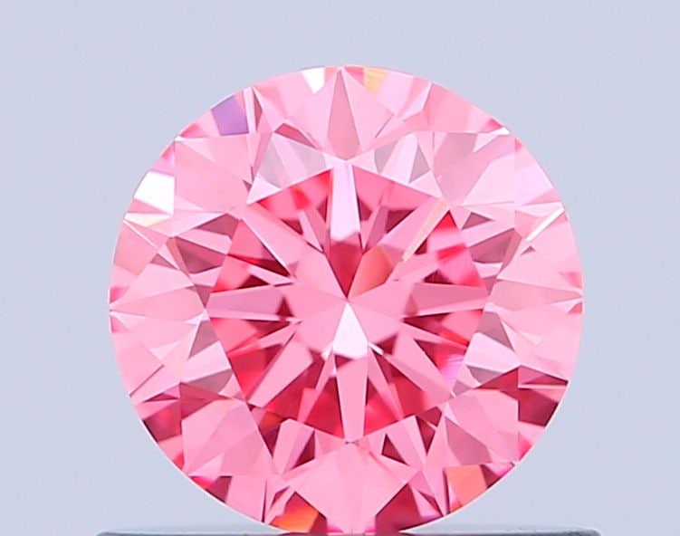 Loose Diamond - ROUND 0.64ct Fancy Vivid Pink VVS2: Loose Diamond - ROUND 0.64ct Fancy Vivid Pink VVS2 Source: This is a real non-mined Diamond that has been grown in a lab Shape: ROUND Carats: 0.64 Color: Fancy Vivid Pink Certification: IGI Video: