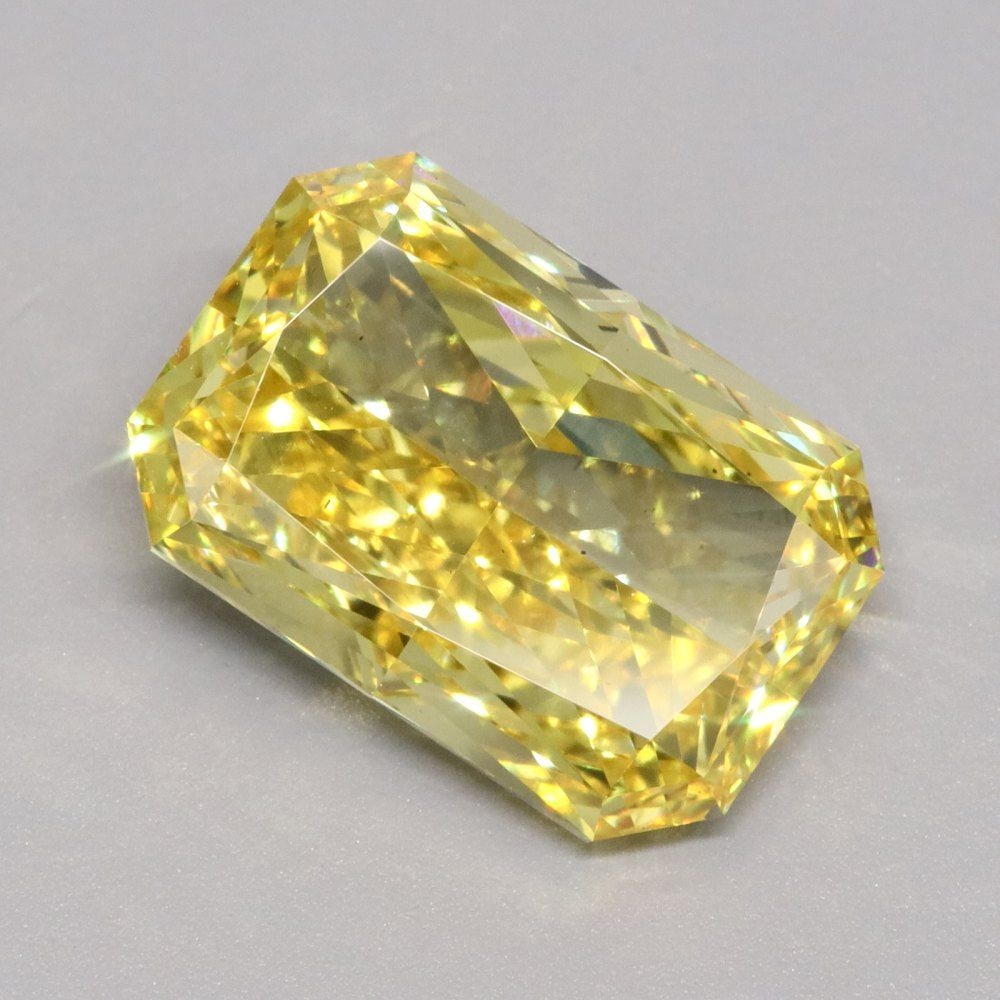 Loose Diamond - RADIANT 5.01ct Fancy Vivid Yellow VS2: Loose Diamond - RADIANT 5.01ct Fancy Vivid Yellow VS2 Source: This is a real non-mined Diamond that has been grown in a lab Shape: RADIANT Carats: 5.01 Color: Fancy Vivid Yellow Certification: IGI Vid