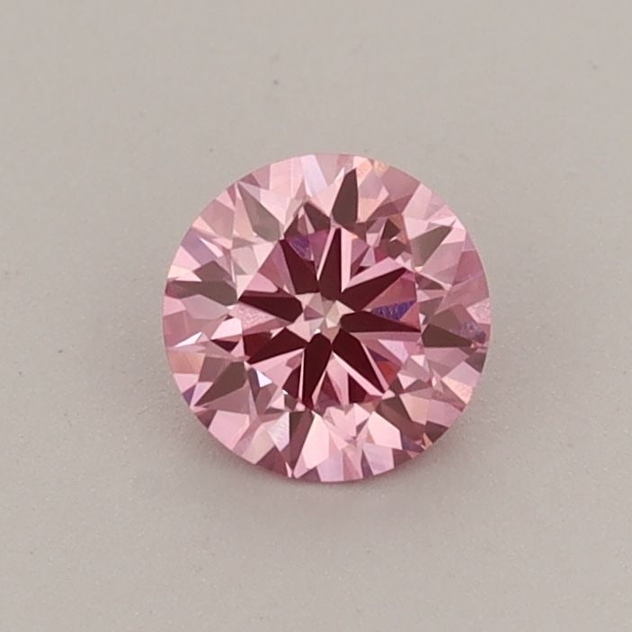 Loose Diamond - ROUND 0.45ct Fancy Vivid Pink VVS2: Loose Diamond - ROUND 0.45ct Fancy Vivid Pink VVS2 Source: This is a real non-mined Diamond that has been grown in a lab Shape: ROUND Carats: 0.45 Color: Fancy Vivid Pink Certification: IGI The Diamon