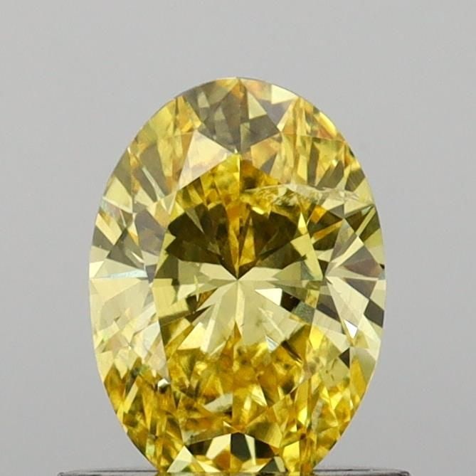 Loose Diamond - OVAL 0.72ct Fancy Vivid Yellow SI2: Loose Diamond - OVAL 0.72ct Fancy Vivid Yellow SI2 Source: This is a real non-mined Diamond that has been grown in a lab Shape: OVAL Carats: 0.72 Color: Fancy Vivid Yellow Certification: IGI Video: