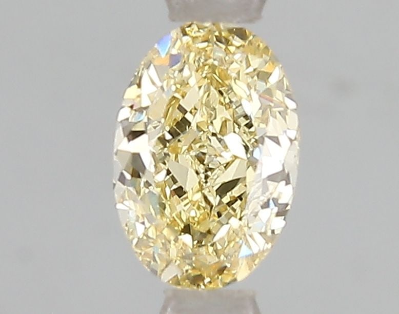 Loose Diamond - OVAL 1.03ct Fancy Intense Yellow VS2: Loose Diamond - OVAL 1.03ct Fancy Intense Yellow VS2 Source: This is a real non-mined Diamond that has been grown in a lab Shape: OVAL Carats: 1.03 Color: Fancy Intense Yellow Certification: IGI Video