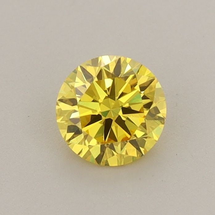 Loose Diamond - ROUND 0.55ct Fancy Vivid Yellow VVS2: Loose Diamond - ROUND 0.55ct Fancy Vivid Yellow VVS2 Source: This is a real non-mined Diamond that has been grown in a lab Shape: ROUND Carats: 0.55 Color: Fancy Vivid Yellow Certification: IGI Video: