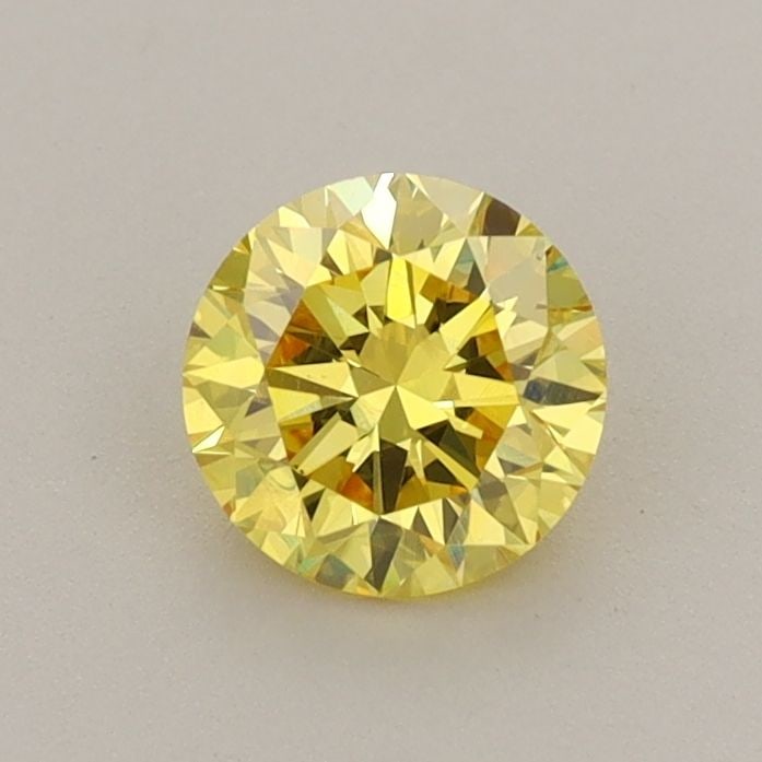 Loose Diamond - ROUND 0.71ct Fancy Vivid Yellow VS1: Loose Diamond - ROUND 0.71ct Fancy Vivid Yellow VS1 Source: This is a real non-mined Diamond that has been grown in a lab Shape: ROUND Carats: 0.71 Color: Fancy Vivid Yellow Certification: IGI Video: