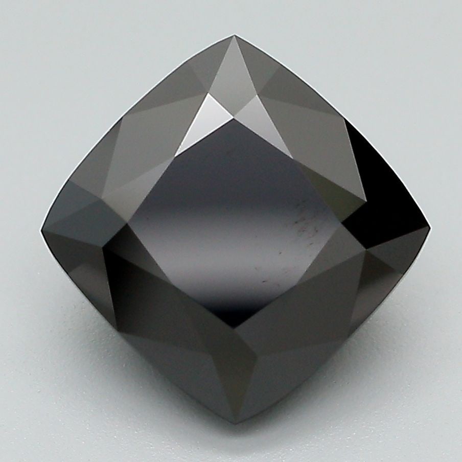 Loose Diamond - CUSHION MODIFIED 4.1ct Fancy Black: Loose Diamond - CUSHION MODIFIED 4.1ct Fancy Black Source: This is a real non-mined Diamond that has been grown in a lab Shape: CUSHION MODIFIED Carats: 4.1 Color: Fancy Black Certification: IGI Video